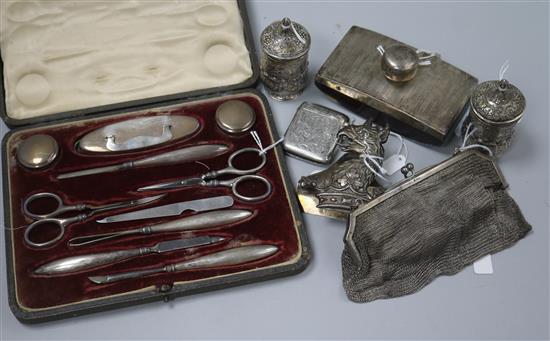 A pair of Anglo-Indian ornate white metal peppers, a silver vesta case and sundry items